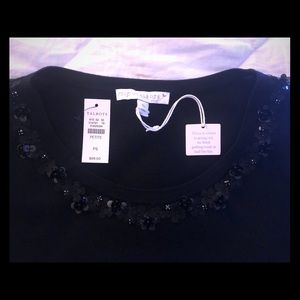 Black knit top with flower sequin neckline